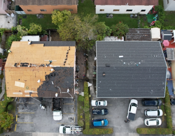 Top-down aerial comparison of two roof decks, one undergoing old shingle tear-off and another fully covered with black underlayment.